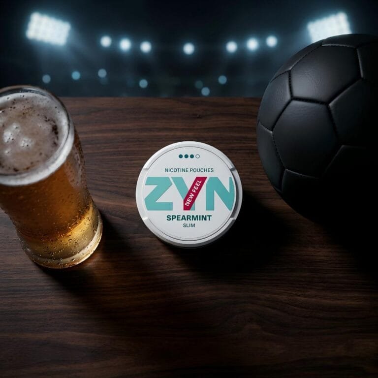 Nicotine pouch tin next to a soccer ball and a cold glass of beer, prepping for the 2026 World Cup.