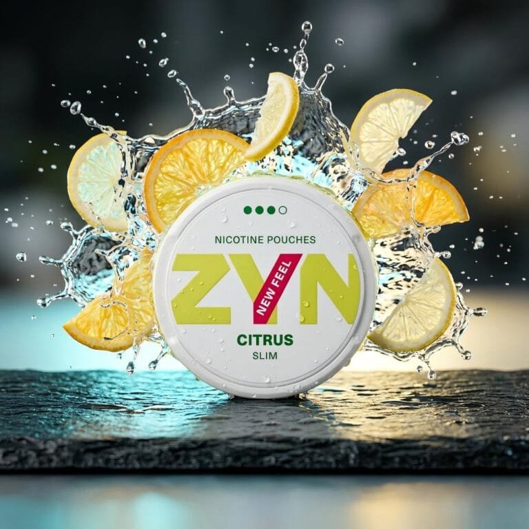 ZYN Citrus EU nicotine pouch tin surrounded by splashing water, fresh lemon, and orange slices representing the refreshing flavor.